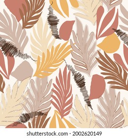 Trendy seamless autumn pattern in natural yellow and brown tones, abstract tropical palm leaves, hand drawn,  Fashionable template for design, packaging, wallpaper, for textiles, vector illustration.