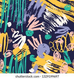 Trendy seamless pattern with colorful paint traces, brush strokes, scribble on dark background. Modern vector illustration in grunge style for wrapping paper, wallpaper, textile print, backdrop.