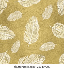 Trendy seamless pattern with feathers on gold background