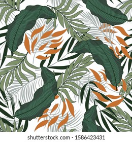 Trendy seamless tropical pattern with bright orange and green plants and leaves on a delicate background. Vector design. Jungle print. Floral background.  
Tropic leaves in bright colors.