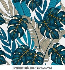 Trendy seamless tropical pattern with bright blue plants and leaves on a white background. Seamless exotic pattern with tropical plants. Tropic leaves in bright colors.
