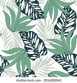 Trendy seamless tropical pattern with bright colorful plants and leaves on a white background. Vector design. Jungle print. Floral background.  Modern abstract design for fabric, paper, interior decor