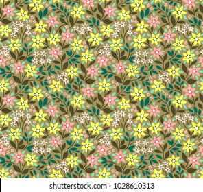 Trendy seamless vector floral pattern. Endless print made of small pink and yellow flowers, leaves and berries. Summer and spring motifs. Pale green background.Vector illustration.
