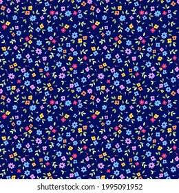 Trendy seamless vector floral pattern. Ditsies print made of small colorful flowers. Summer and spring motifs. Bright blue background. Stock vector illustration.