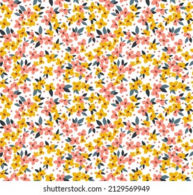 Trendy seamless vector floral pattern. Endless print made of small yellow and orange flowers. Summer and spring motifs. White background. Stock vector illustration.