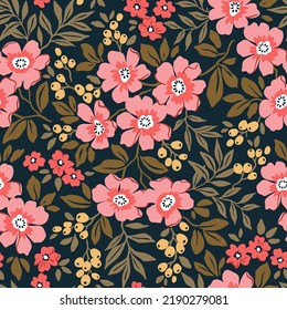 Trendy seamless vector floral pattern. Endless print made of small pink flowers and yellow berries. Summer and spring motifs. Black background. Stock vector illustration.