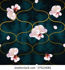 Trendy seamless vector pattern with spring blossom mood. Tony gold waves shapes with plum tree flowers and petals on emerald velvet textured background.