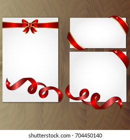 Trendy Set of beautiful cards with red and gold gift bows and ribbons on high quality wooden plank background. Place for text