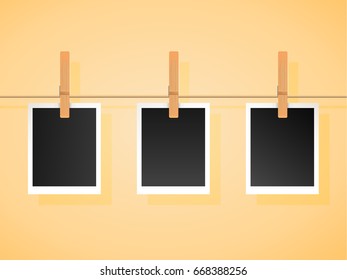 Trendy Set of empty photo frames on a rope with wooden clothspins pegs isolated on background. Vector design to use with your own photos and images