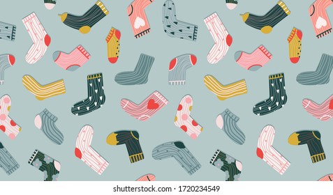 Trendy socks seamless pattern. Cozy hand-drawn cartoon style socks on a pastel green background. Variety of funny socks. Modern vector design for stationery, textile and web use. Trendy apparel.