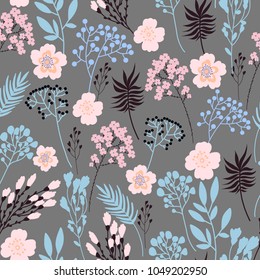 Trendy summer floral seamless pattern with wild graceful flowers and branches. Vector background. Hand drawn fashion design.