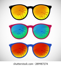 Trendy sunglasses with colorful lens and frame reflect summer palms