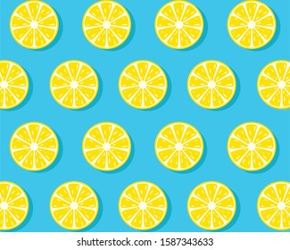 Trendy sunlight Summer pattern made with yellow lemon slice on bright light blue background. Minimal summer concept.
