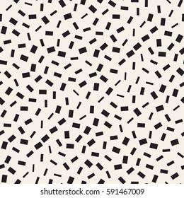Trendy Texture With Scattered Geometric Shapes.  Inspired by Memphis Design. Abstract Monochrome Background. Vector Seamless Pattern.