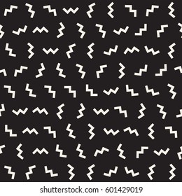 Trendy Texture With Scattered Geometric Shapes.  Inspired by Memphis Design. Abstract Monochrome Background. Vector Seamless Pattern.