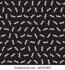 Trendy Texture With Scattered Geometric Shapes.  Inspired by Memphis Design. Abstract Monochrome Background. Vector Seamless Pattern.