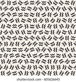 Trendy Texture With Scattered Geometric Shapes.  Inspired by Memphis Design. Abstract Monochrome Background. Vector Seamless Pattern.