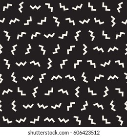 Trendy Texture With Scattered Geometric Shapes.  Inspired by Memphis Design. Abstract Monochrome Background. Vector Seamless Pattern.