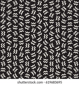 Trendy Texture With Scattered Geometric Shapes. Vector Seamless Pattern.