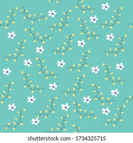 Trendy tiny yellow and white wildflower seamless pattern on blue background for fashion print. 