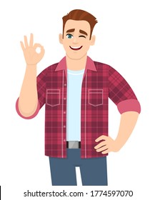 Trendy young man showing okay sign and winking eye. Stylish person making OK or cool gesture with fingers. Male character illustration isolated. Human emotions & expressions concept in vector cartoon.