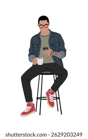 Trendy young man with tattoos, glasses, blue jacket, and red sneakers sitting on a stool with coffee and phone. Modern hipster style illustration. Isolated on white background