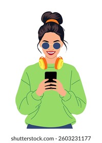 Trendy young woman in green hoodie with sunglasses and headphones using smartphone. Modern vector illustration of a stylish girl browsing social media isolated on white background