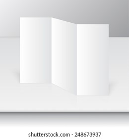 Tri fold brochure design standing on a shelf. mock up. 