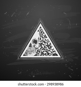 Triangle with flowers and skull in the style of tattoos