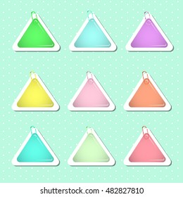 Triangle paper sticker shapes with paper clips, in pastel colors. Vector EPS-10 file, transparency used. 