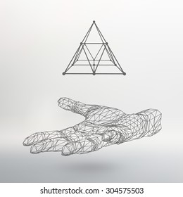 triangle pyramid on the arm. The hand holding a pyramid. Polygon triangle. Polygonal hand. White background. The shadow of the objects in the background.