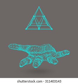 triangle pyramid on the arm. The hand holding a pyramid. Polygon triangle. Polygonal hand. White background. The shadow of the objects in the background.