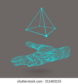 triangle pyramid on the arm. The hand holding a pyramid. Polygon triangle. Polygonal hand. White background. The shadow of the objects in the background.