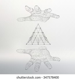 triangle pyramid on the arm. The hand holding a pyramid. Polygon triangle. Polygonal hand