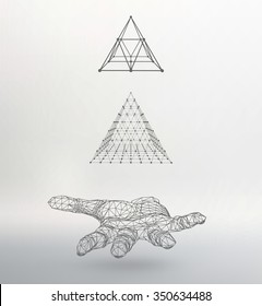 triangle pyramid on the arm. The hand holding a pyramid. Polygon triangle. Polygonal hand. White background. The shadow of the objects in the background