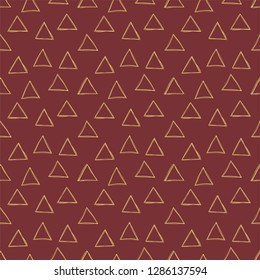 Triangle seamless pattern. Vector golden and burgundy background. Scrapbook, gift wrapping paper, textiles. Doodle sketch