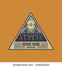 Triangle shaped emblem of pine forest mountain
