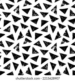 Triangle stamps seamless pattern. Repeating geometric tiles from triangles. Hand drawn grunge geometric elements ornament. Modern stylish vector texture. Black and white background.