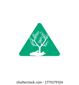 Triangle Tree in hand vector logo design. Natural products Triangle  logo. Cosmetics icon.