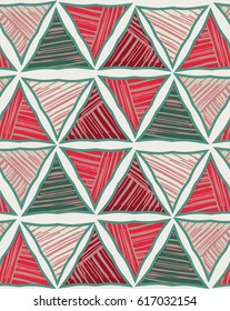 Triangles red green striped on light.Hand drawn with ink seamless background.Creative handmade repainting design for fabric or textile.Geometric pattern with triangles.Vintage retro colors