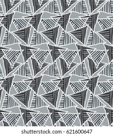 Triangles striped with black on green.Hand drawn with ink seamless background.Creative handmade repainting design for fabric or textile.Geometric pattern with triangles.Vintage retro colors