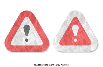 triangles with a texture of crumpled paper and exclamation mark