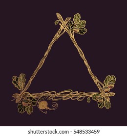 Triangular golden frame of oak branches with leaves. Decorative element for design work in the boho style. Wreath on a dark backg.