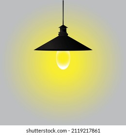 Triangular lamp in black and gray background.