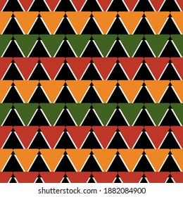 Tribal African ethnic seamless pattern with simple triangles in red, yellow,green, black. Vector traditional ornament for background, textile, paper, fabric. Kwanzaa, Black history month
