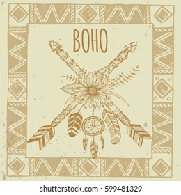 Tribal arrow in ethnical pattern with feathers and wild flowers