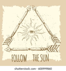 Tribal arrow in ethnical pattern with feathers , sun and third eye