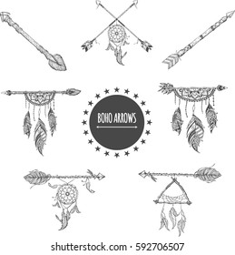 Tribal arrow set in ethnical pattern with feathers and dream catcher