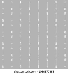 Tribal arrows hipster. vector pattern on the grey background.