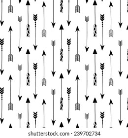 Tribal arrows on white background. Seamless vector pattern.